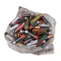 Bag of small domestic dry cell batteries, old trash to recycle. Isolated on white. Alkaline . Europe, UK AA and AAA size