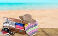 Travel bag on beach background Royalty Free Stock Photo