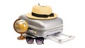 Bag travel. Suitcase, sunglasses with toy plane, straw hat and globe in travel composition isolated on white background Royalty Free Stock Photo