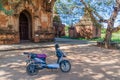 BAGAN, MYANMAR - DECEMBER 6, 2016: E-bike electric scooter in front of a temple in Bagan, Myanm Royalty Free Stock Photo