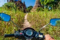 BAGAN, MYANMAR - DECEMBER 6, 2016: E-bike electric scooter in front of temples in Bagan, Myanm Royalty Free Stock Photo