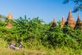 BAGAN, MYANMAR - DECEMBER 6, 2016: E-bike electric scooter and old temples in Bagan, Myanm Royalty Free Stock Photo