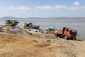 Bagan, Myanmar, December 27 2017: Workers load sand on ship at the jetty Royalty Free Stock Photo