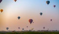 Hot air balloons at sunrise over the pagodas and temple area