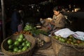 BAGAN, MYANMAR: FEBRUARY 21, 2015 : Local women sell their produce at an outdoor market in Bagan on February 21, 2015. The market