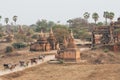 Bagan, Myanmar - March 2019: horse carriages driving tourists through ancient temples and pagodas Royalty Free Stock Photo