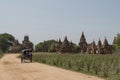 Bagan, Myanmar - May 6, 2017: Bagan ancient pagodas and a horse carriage