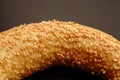Bagel from the bakery is close. Golden color. Sprinkled with sesame seeds.