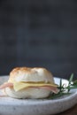 Bagel ham cheese in close up on wooden table in coffee shop Royalty Free Stock Photo