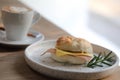 Bagel ham cheese in close up on wooden table in coffee shop Royalty Free Stock Photo