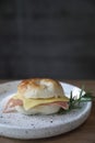 Bagel ham cheese in close up on a plate in coffee shop Royalty Free Stock Photo