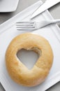 Bagel with a heart-shaped hole Royalty Free Stock Photo