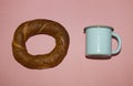 Bagel and metal blue cup Royalty Free Stock Photo