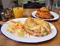 Bagel with salmon with pancakes and orange juice on the background