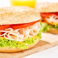 Bagel sandwich with chicken ham for breakfast close up square Royalty Free Stock Photo