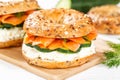 Bagel sandwich with salmon and cream cheese for breakfast on a kitchen board Royalty Free Stock Photo