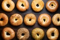 Bagels arranged on kitchen table in flat lay photo, breakfast variety