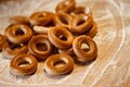 Bagels with flour on wooden background. Selective focus.