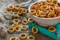 Bagels with salt in a wooden bowl.