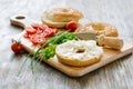 Bagels wtih cream cheese, tomatoes and chives for healthy snack