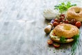 Bagels wtih cream cheese, tomatoes and chives for healthy snack