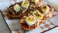 Bagette toast with tomato, tuna and goat cheese.