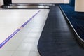 Baggage claim at the airport. Carousel area for passenger waiting for belonging, selective focus Royalty Free Stock Photo