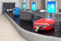 Baggage claim in airport terminal. Suitcases on the airport luggage conveyor belt Royalty Free Stock Photo