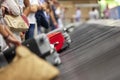 Baggage claim luggage conveyor belt with suitcase at airport Royalty Free Stock Photo