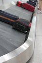 Baggage claim suitcase on conveyor belt at the airport luggage to reclaim background copy space Royalty Free Stock Photo