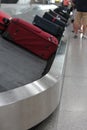 Baggage claim suitcase on conveyor belt at the airport luggage to reclaim background copy space Royalty Free Stock Photo