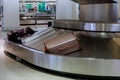 Baggage claim in the suitcases on a luggage band on the airport Royalty Free Stock Photo