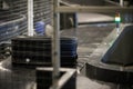 Baggage on a conveyor belt inside a luggage sorting system at an airport Royalty Free Stock Photo