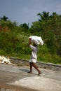 Baggage handler - toil of Indian coolie worker