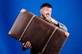 Baggage insurance. Man well groomed bearded hipster with big suitcase. Take all your things with you. Heavy suitcase Royalty Free Stock Photo