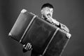 Baggage insurance. Man well groomed bearded hipster with big suitcase. Take all your things with you. Heavy suitcase Royalty Free Stock Photo