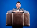 Baggage insurance. Travel and baggage concept. Hipster traveler with baggage. Man well groomed bearded hipster with big Royalty Free Stock Photo