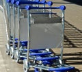 Baggage or luggage carts at an airport in a row Royalty Free Stock Photo