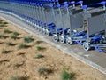 Baggage or luggage carts at an airport in a row Royalty Free Stock Photo