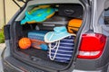 Baggages in the car trunk packed and ready to go for holidays Royalty Free Stock Photo
