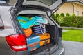 Baggages in the car trunk packed and ready to go for holidays Royalty Free Stock Photo