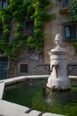 Bagolino medieval village, public water fountain in the central square Royalty Free Stock Photo