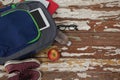 Bagpack, water bottle, apple, digital tablet, shoes and spectacle Royalty Free Stock Photo