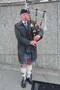 Bagpiper blowing his pipes, Edinburgh Royalty Free Stock Photo