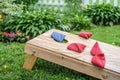 playing bags corn hole game in backyard Royalty Free Stock Photo