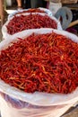 Bags of bright red dried chillis for sale at an Asian food market Royalty Free Stock Photo