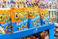 Bags of Cheetos brand cheese puffs for sale