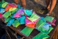 Bags with colorful paints for Holi festival ready for sale. Many packages of different colors