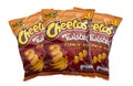 3 Bags of flamin hot  flavor twisted  Cheetos on a white background Royalty Free Stock Photo