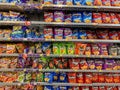 bags of potato and corn chips on a store shelf display Royalty Free Stock Photo